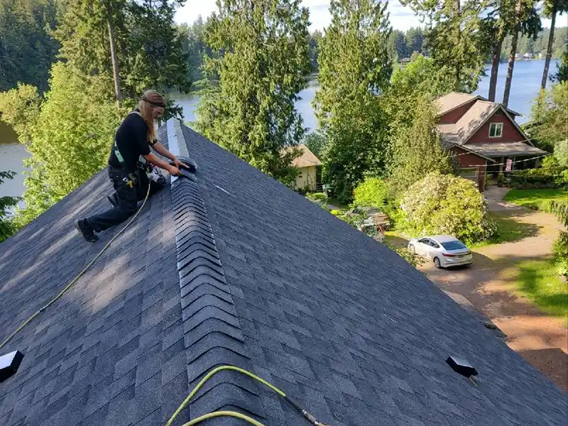 Installing new shingles in Rochester